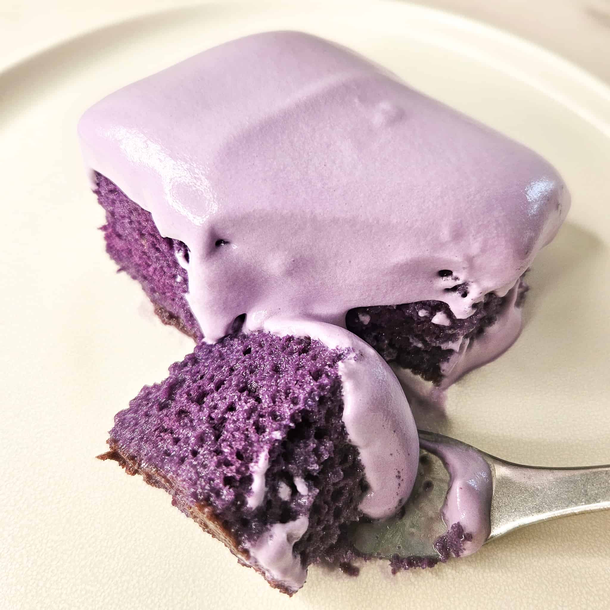 Fork slicing ube tres leches