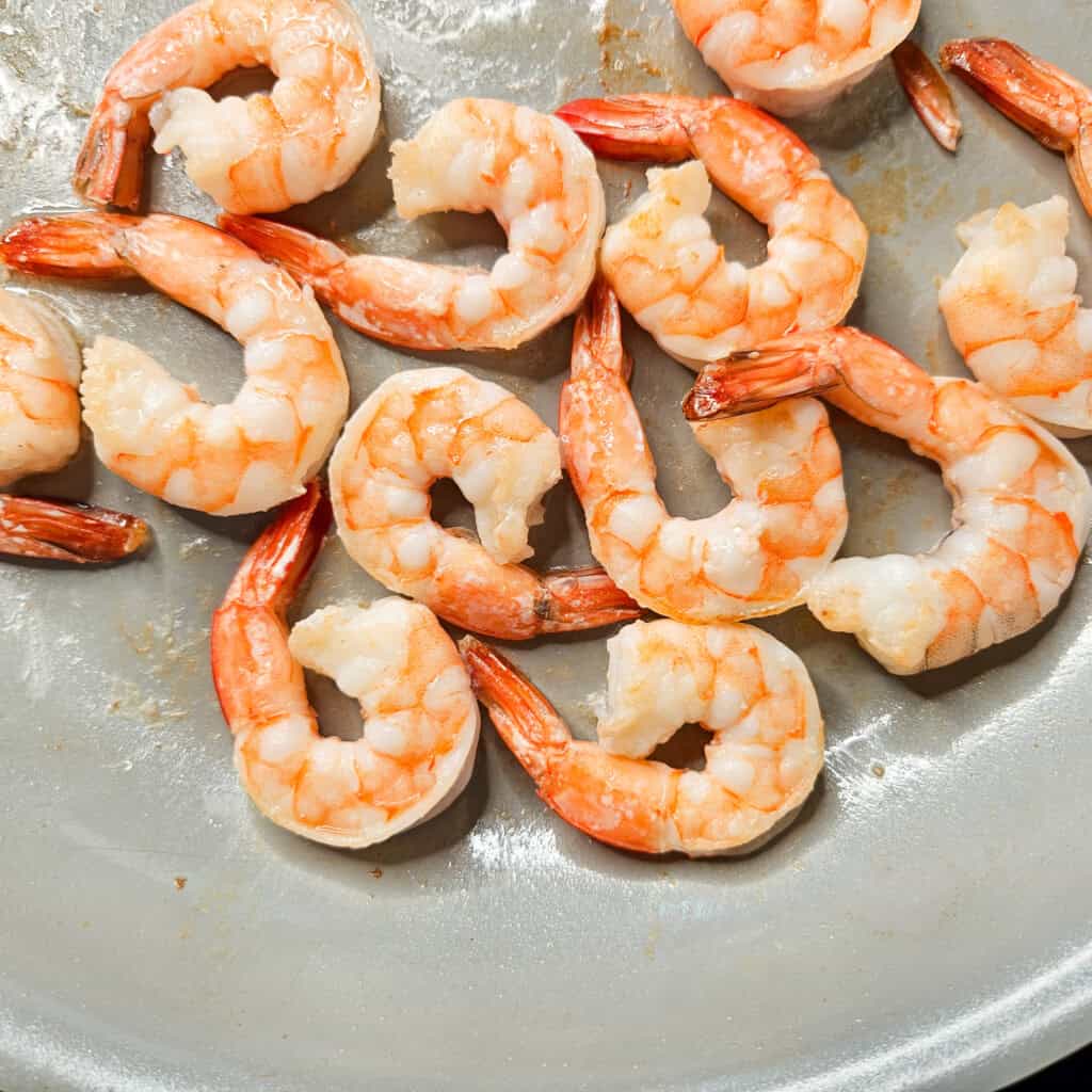 Shrimp being fried in a pan