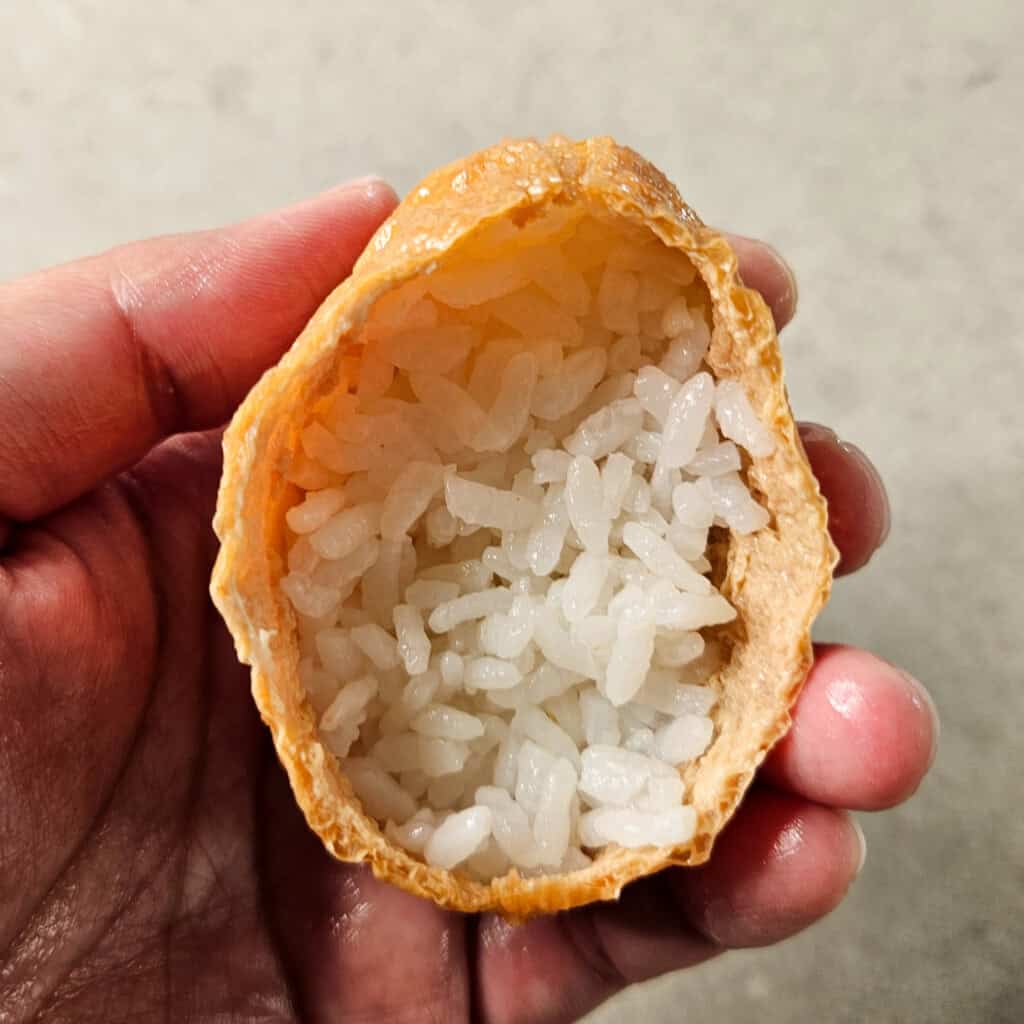 Sushi rice inside a tofu skin pouch