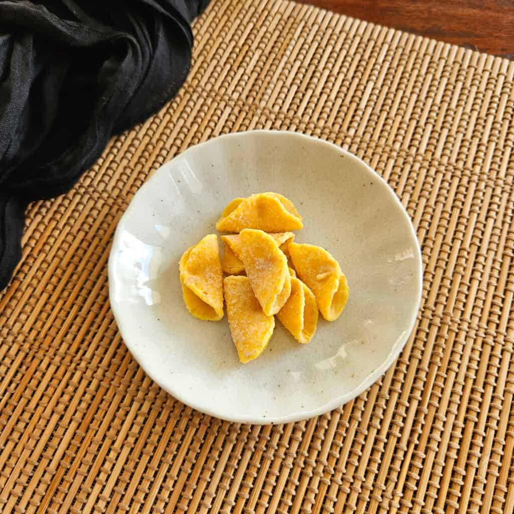 A small plate with Yuzu rice crackers