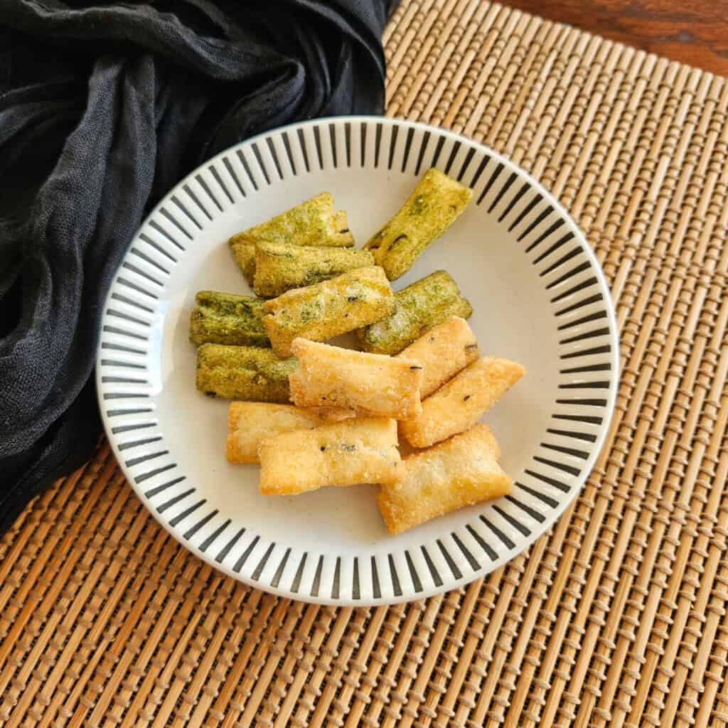 Pieces of Japanese arare on a striped plate