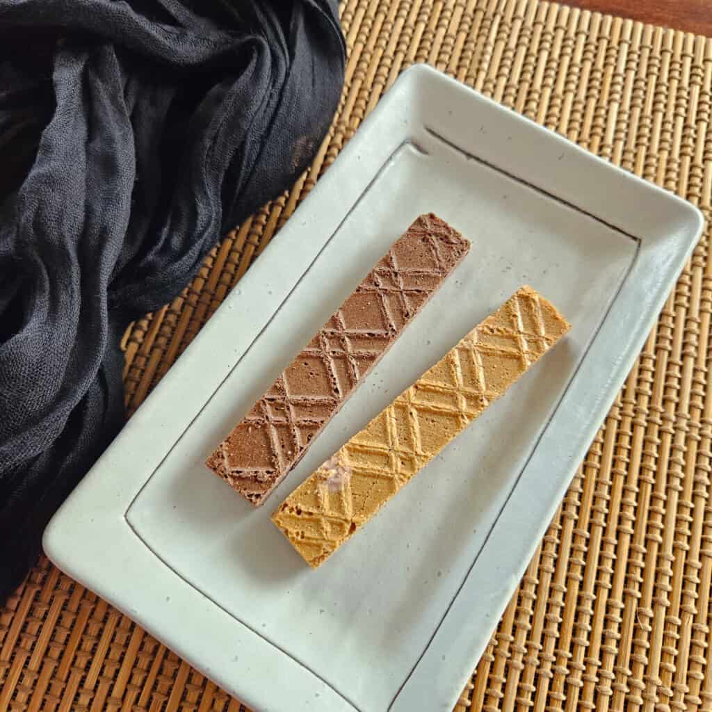 Two Japanese grape wafers on a long plate